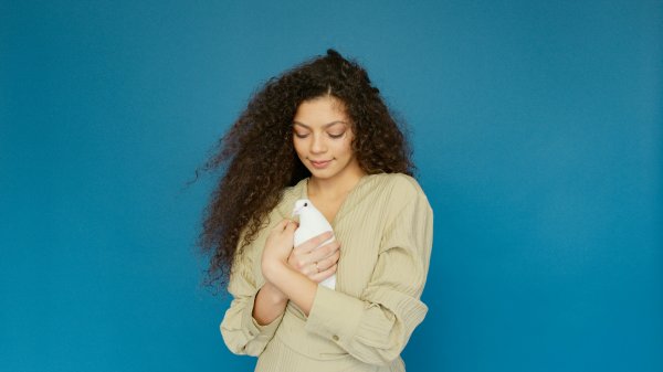 woman holding a white dove